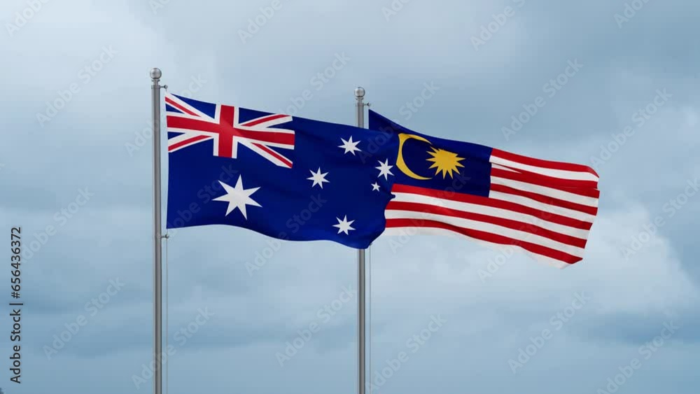 Malaysia and Australia flag waving together on cloudy sky, endless seamless loop, two country cooperation concept Malaysia and Australia flag waving together on cloudy sky, endless seamless loop, two country cooperation concept