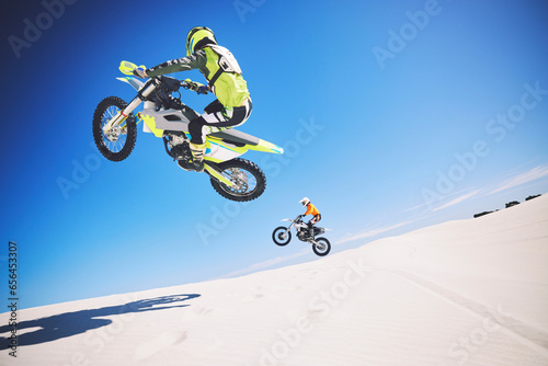 Fototapeta Naklejka Na Ścianę i Meble -  Motorbike, people and sports with fitness, competition and training with safety, desert and workout. Athletes, sand and bikers with mockup, practice and cycling with exercise, challenge and energy
