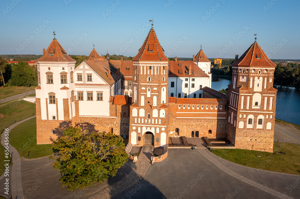 Belorussian tourist ladmark attraction Mir Castle at sunny day,  Belarus. Aerial view of a main gate of a medieval castle. Mir Castle Complex, a UNESCO World Heritage site in Belarus.