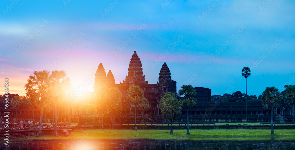 Naklejka premium Sunrise view of popular tourist attraction ancient temple complex Angkor Wat - Siem Reap, Cambodia