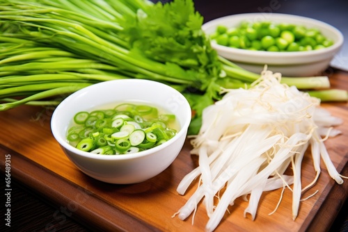 pho garnished with fresh green onions and pepper