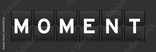 Black color analog flip board with word moment on gray background