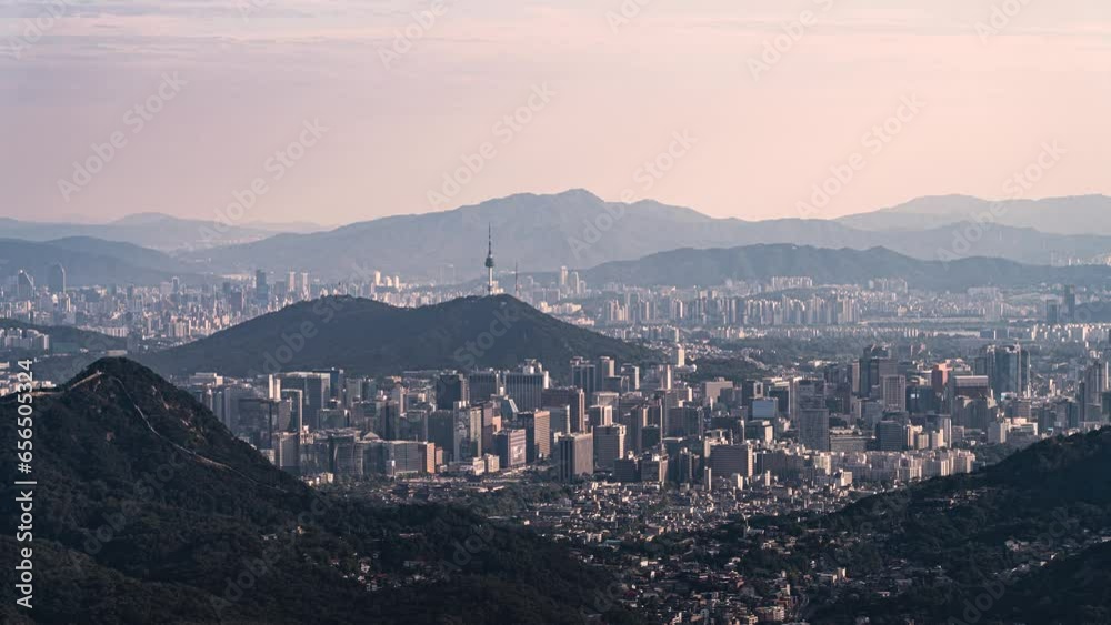 Downtown Seoul and Namsan Tower overlooking Bukhansan Mountain in clear autumn with beautiful skies Downtown Seoul and Namsan Tower overlooking Bukhansan Mountain in clear autumn with beautiful skies