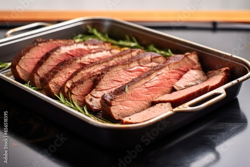 thick-cut beef brisket slices an oven tray