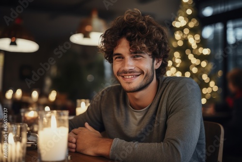 Happy of young man indoors at home at Christmas, holding candle. Generative AI
