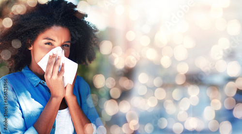 Black woman, blowing nose and allergies, sick with health fail on banner and bokeh, portrait and sinus infection. Healthcare, wellness and illness with mockup space, toilet paper for cold or flu photo