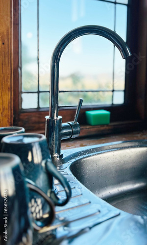 washbasin sink om the kitchen at home with window background 