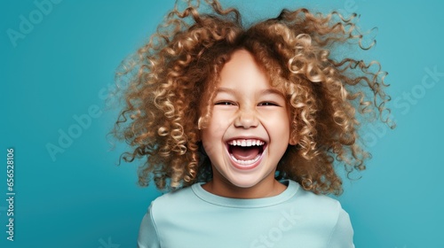 Happy little curly blond girl with big eyeglasses. Isolated on solid blue background - generative AI