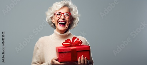 Happy Mature Woman Holding ...