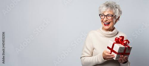 Happy Mature Woman Holding ...
