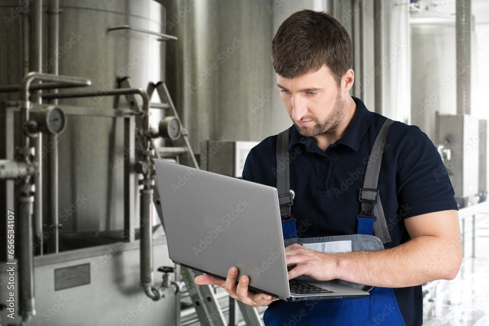 Production engineer worker technologist with laptop. Production engineer worker technologist with laptop.