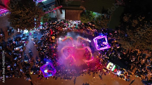 The dragon and lion dance on the night of Vietnam's traditional Mid-Autumn Festival was filmed from the air.  Festival and culture concept.