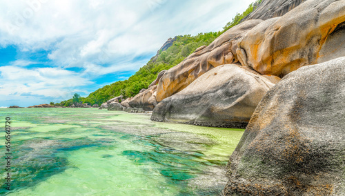Granite rocks and coral reef in world famous Anse Source d'Argent beach