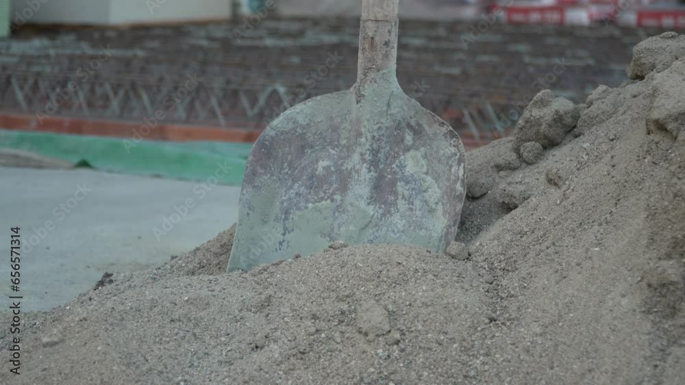 Shovel in sand at the construction site slow motion Shovel in sand at the construction site slow motion
