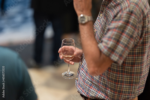Adult male businessman holding a glass of champagne