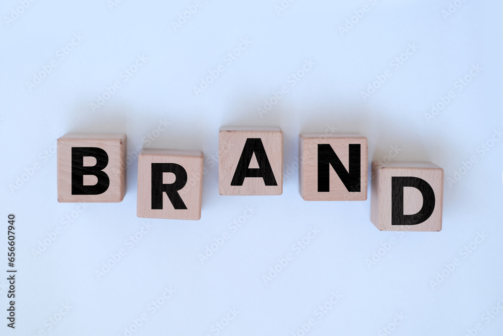 Obraz premium Brand word on block cubes, identity or marketing idea, random wooden block cubes with Brand text, randomly ordered blocks, banner concept