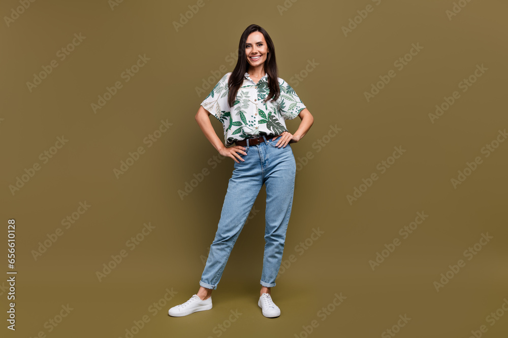 Full length portrait of nice satisfied glad person put hands waist posing isolated on brown color background Full length portrait of nice satisfied glad person put hands waist posing isolated on brown color background