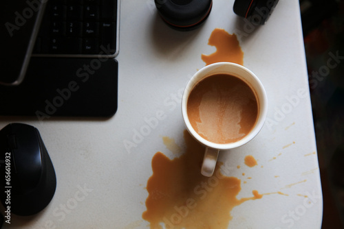 Dirth of coffee on working table photo