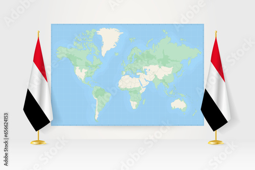 World Map between two hanging flags of Yemen flag stand.