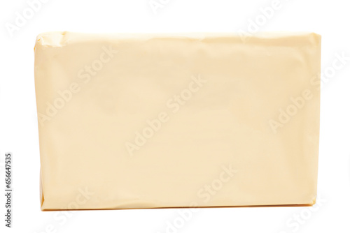 Stick of wrapped butter isolated on white background