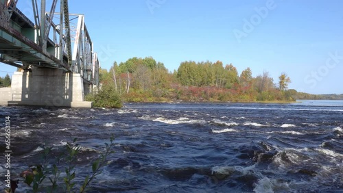 Railway Truss Bridge over rapids in Montreal River in the town of Latchford, Temiskaming District, Ontario, Canada photo