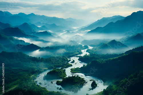 picturesque mountain landscape with green grass and fog