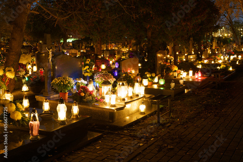 Wallpaper Mural Catholic cemetery during All Saints' Day on November 1, celebrated in the Christian religion. Cemetery at night with many burning candles. Memory of deceased loved ones. Torontodigital.ca