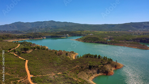 Aerial view of the reservoir with low level of water during a long drought. Forata reservoir, Valencia, Spain. photo