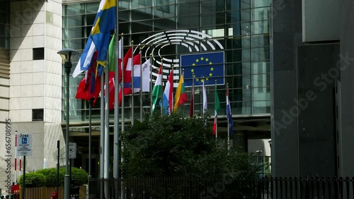 European Parliament headquarters. Peace Flags and states flags flying euro statues farmers protest tractors