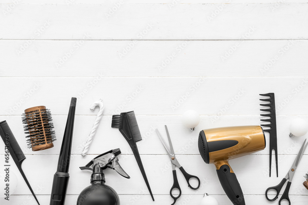 Fototapeta Hairdressing tools with Christmas decor on white wooden background
