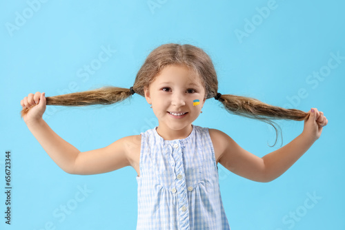Happy little girl with draw...