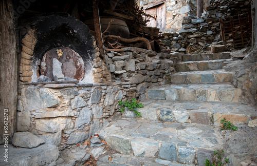 Traditional house exterior courtyard with clay oven at the village of askas in Cyprus photo