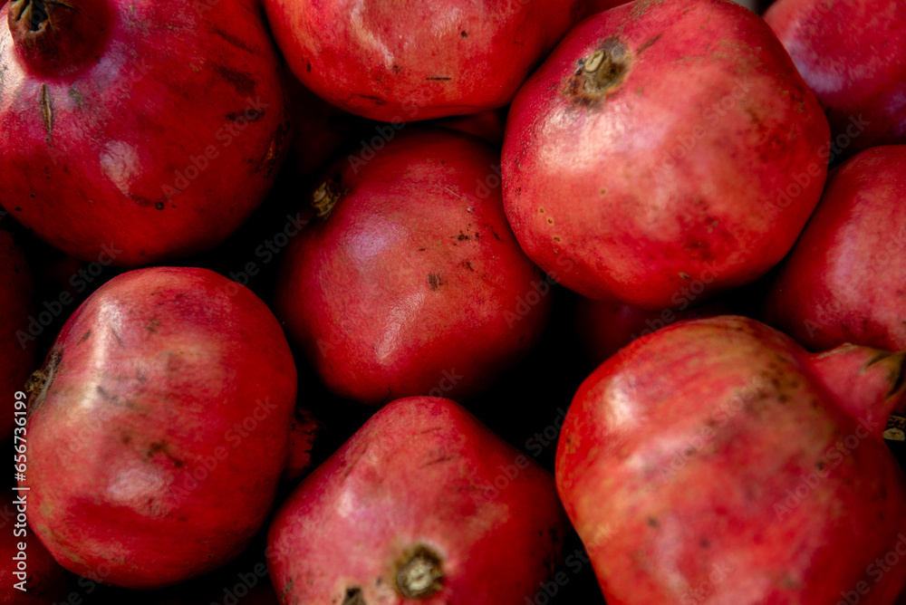 Healthy pomegranate fruit, background, close up top view.