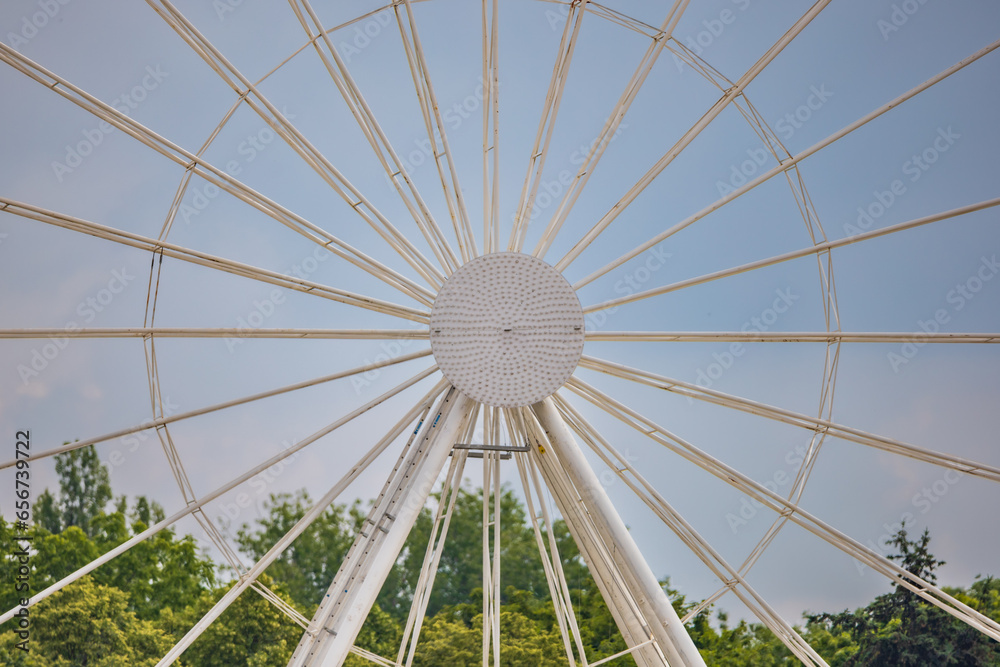 Center of ferris wheel with glowing dots in the middle at sunny afternoon Center of ferris wheel with glowing dots in the middle at sunny afternoon