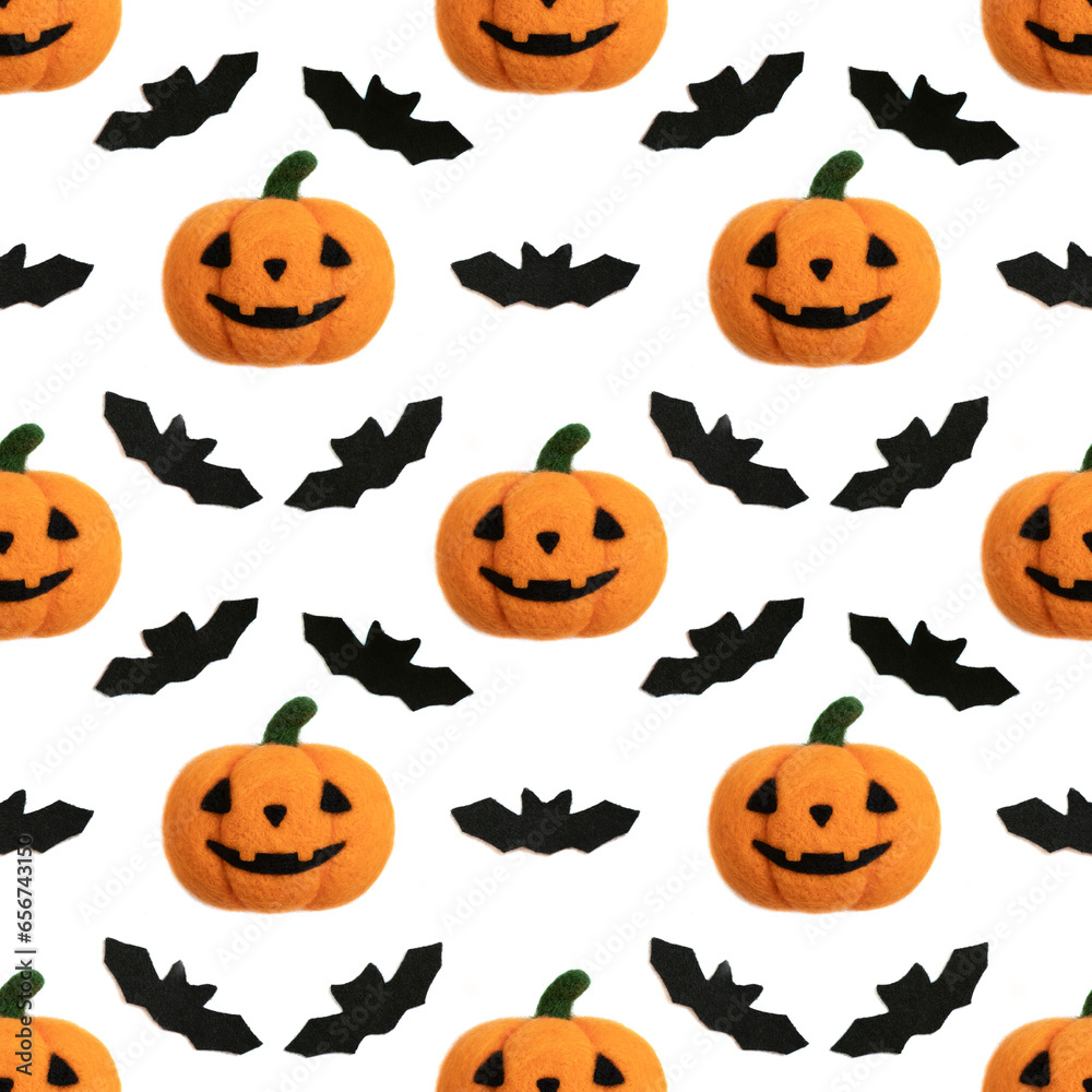 Seamless pattern with Halloween pumpkin and bats on white background. Jack head background. Toy Halloween pumpkin made of wool.