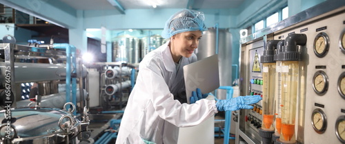 Team worker produces drinking water in a clean drinking water plant. drinking water production line