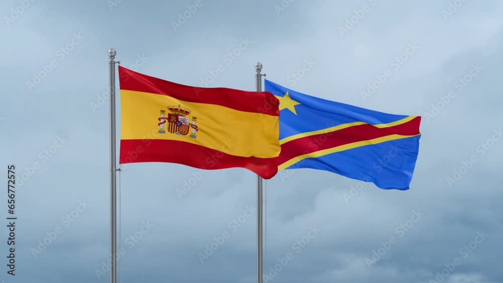 Democratic Republic of the Congo flag and Spain flag waving together on cloudy sky, endless seamless loop, two country relations concept Democratic Republic of the Congo flag and Spain flag waving together on cloudy sky, endless seamless loop, two country relations concept