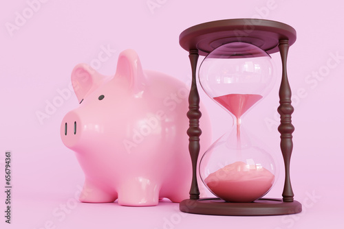 Pink piggy bank standing next to a hourglass on pink background. Illustration of the aphorism of time is money photo