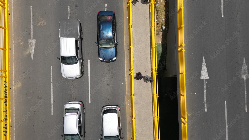 Aerial view of bridge, cars and people crossing Aerial view of bridge, cars and people crossing