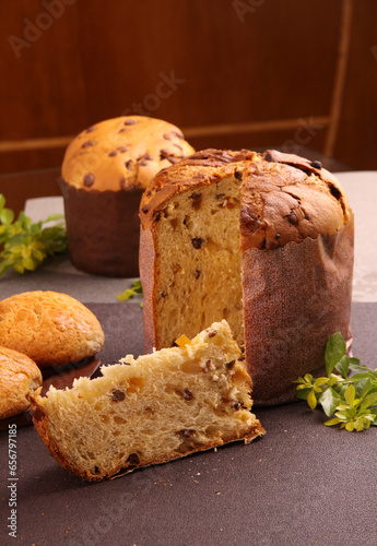 Delicious Panettone and slice with candied fruits, nuts and chestnuts