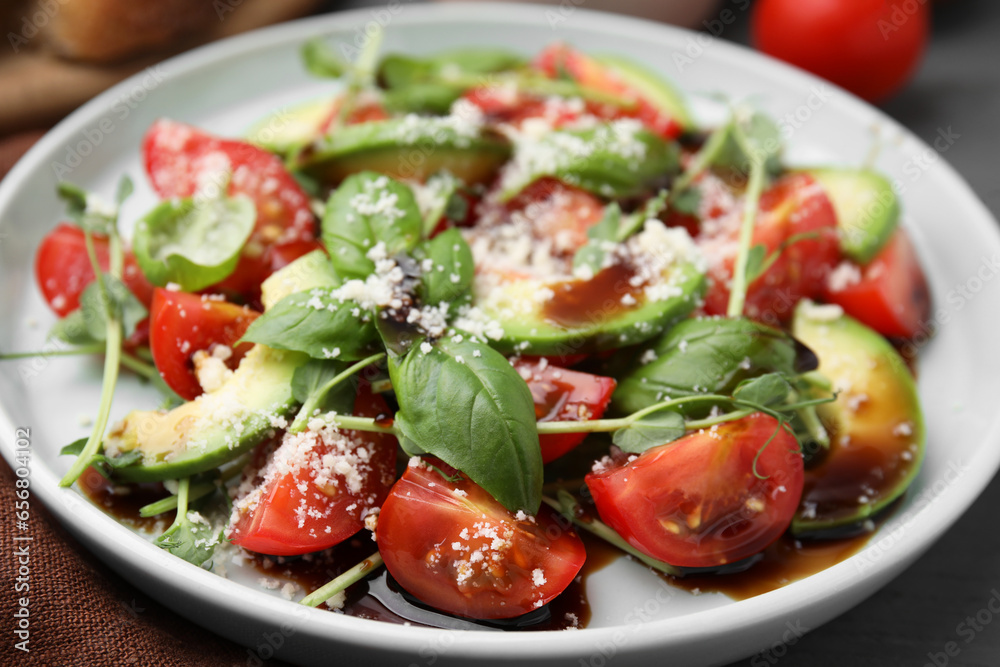 Tasty salad with balsamic vinegar on table, closeup Tasty salad with balsamic vinegar on table, closeup