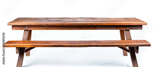 Weathered wooden picnic table on white background symbolizing summer and barbecues