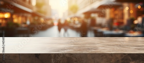 Suitable for showcasing or creating product montages with a stone tabletop and a blurry shopping plaza background