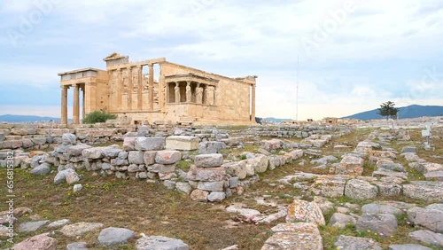Erechtheion caryatid temple ruins building with marble columns at Athens Greece Acropolis hill, wide angle view of pov point of view walking