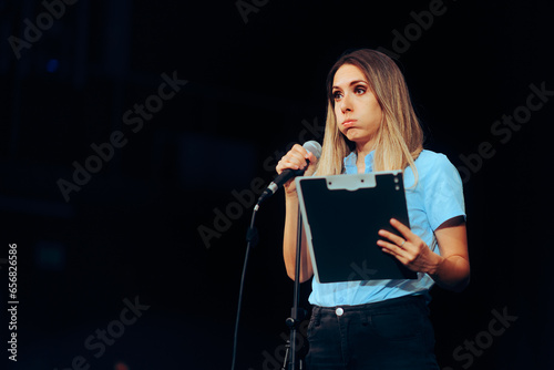 Obraz na płótnie Stressed Speaker Holding a Clipboard Taking on a Microphone ion a Stage