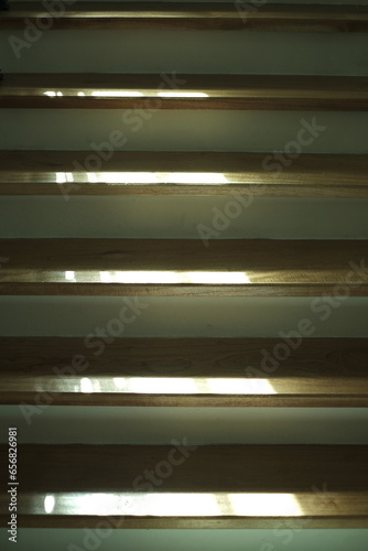 light and shadow on wooden stair steps