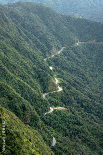 Winding road, top view of beautiful aerial view of asphalt road, highway through forest. Banner panorama background