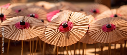 Paper umbrellas in a basket at a summer wedding on a sweltering day