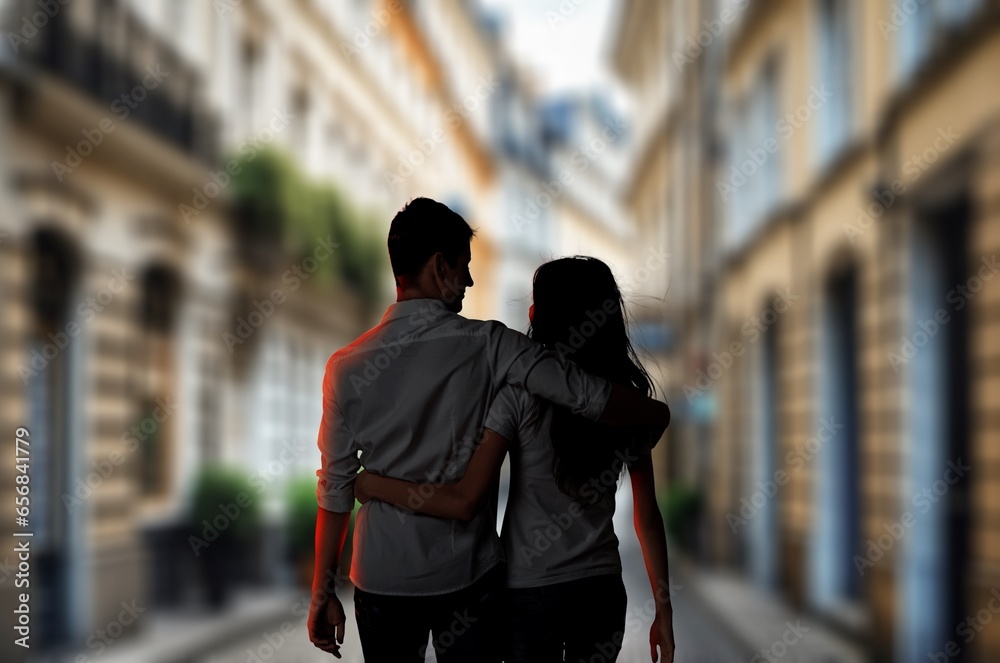 Fototapeta premium Vacation Tour concept. Back Couple Hugging And Walking On Street