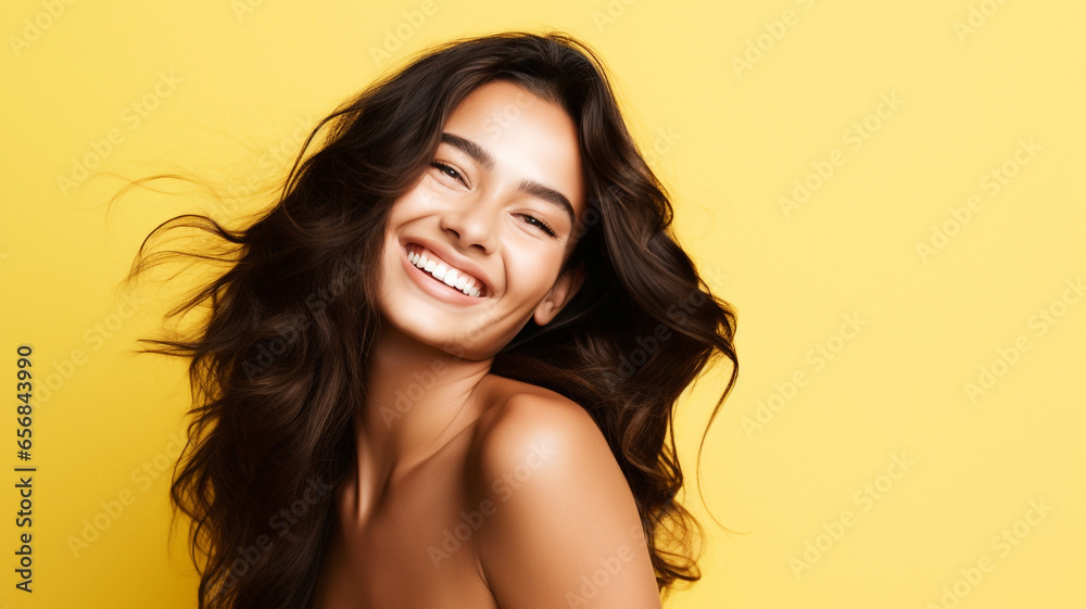 Happy young woman on a yellow background Happy young woman on a yellow background